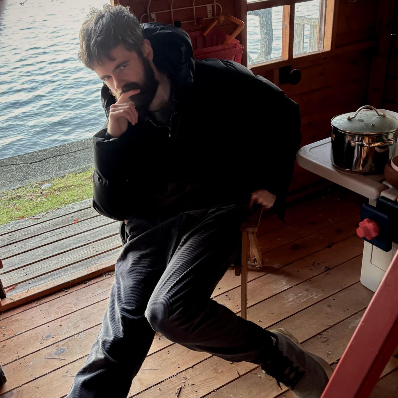 Christopher "in a playhouse on the shoreline in Vashon looking sullen in a just-surreal-enough environment."