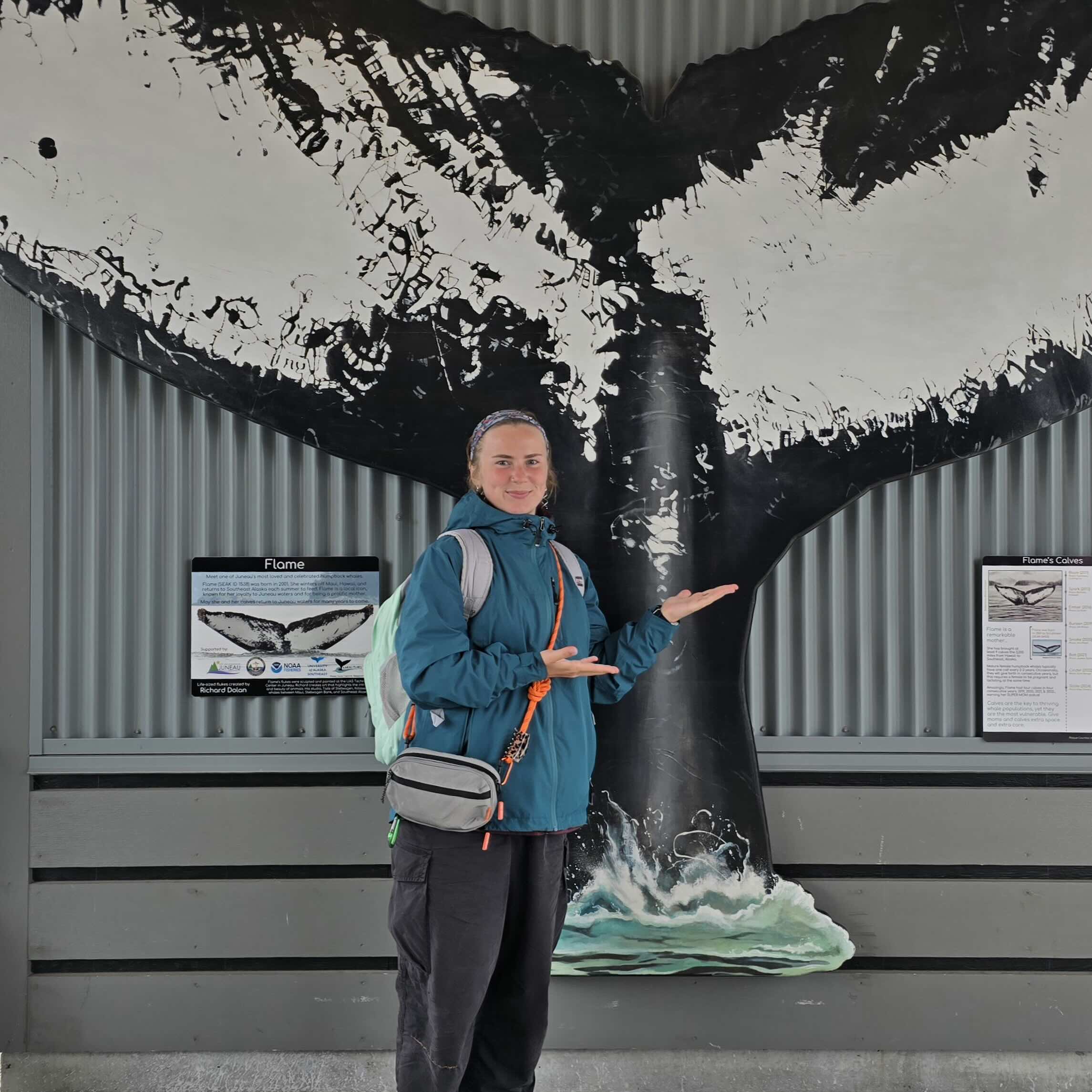 Dasha in front of a whale display