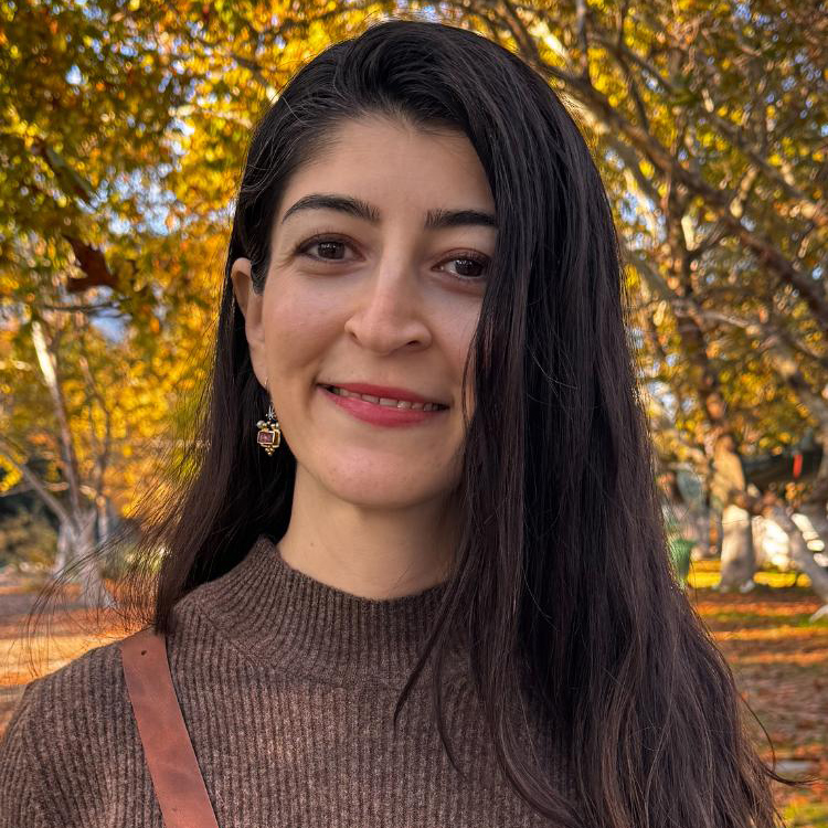 Sibel in the autumn trees.